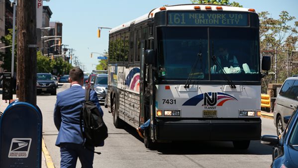 commuters getting on bus in Union City