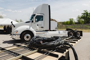 In a pilot project beginning this year, black coils will be used to transfer power to a heavy-duty electric Cummins truck. Purdue University photo/Greta Bell