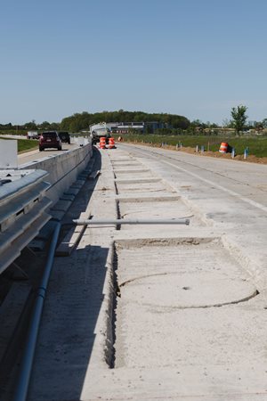 Construction on a quarter-mile segment in Indiana that will be used to test wireless power transfer to a heavy-duty electric truck as it drives across the pavement. Credit: Purdue University/Greta Bell