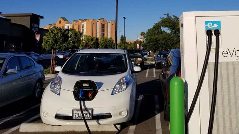 electric car plugged in and charging in California